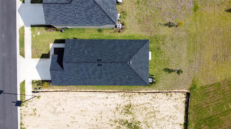 Aerial view of the home and lot